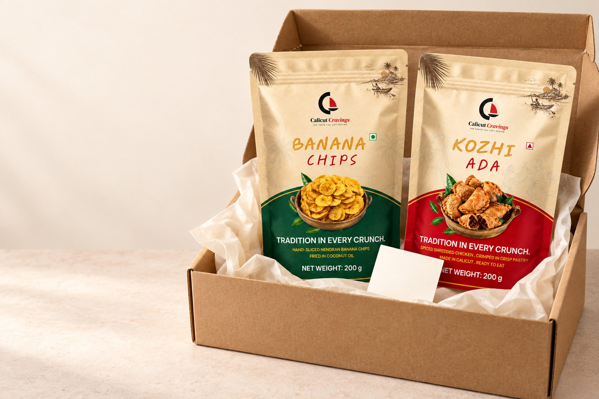 Both Calicut Cravings packs standing in tissue inside a plain kraft courier carton.