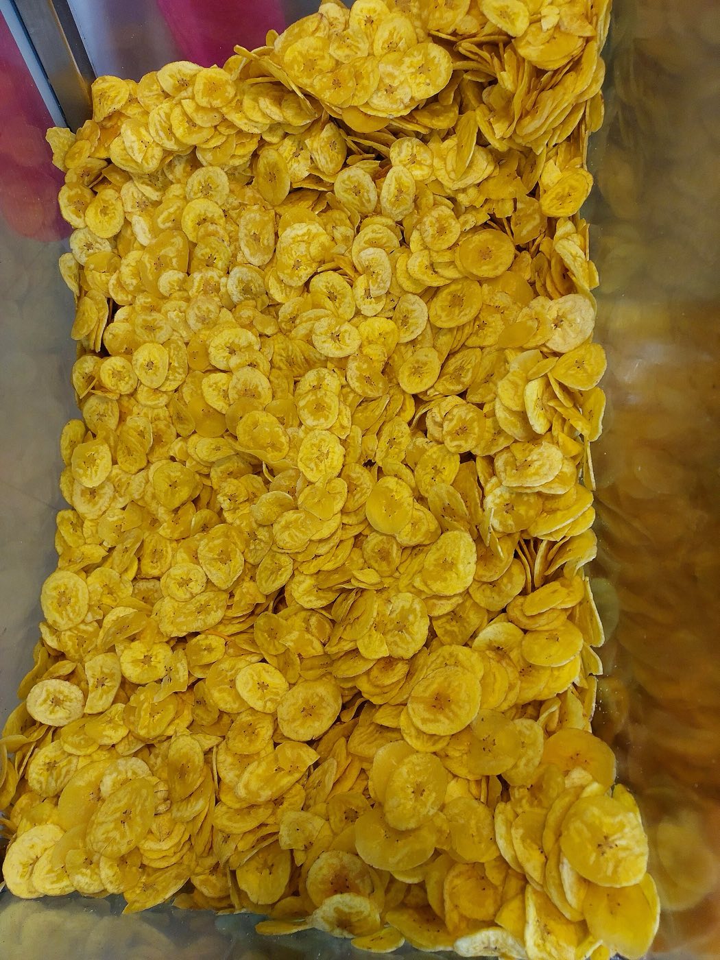 Golden Kerala banana chips fried in coconut oil.