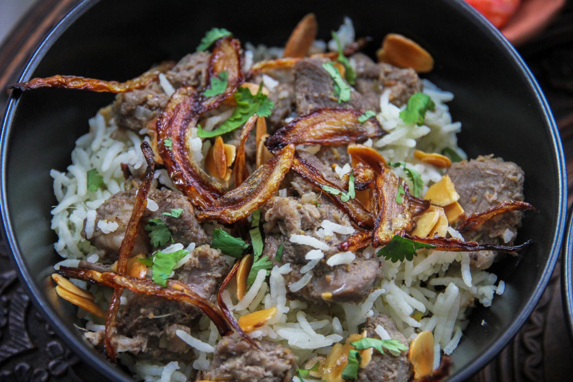 Erachi Choru - Malabar one-pot meat rice with tender beef, garnished with fried onions.