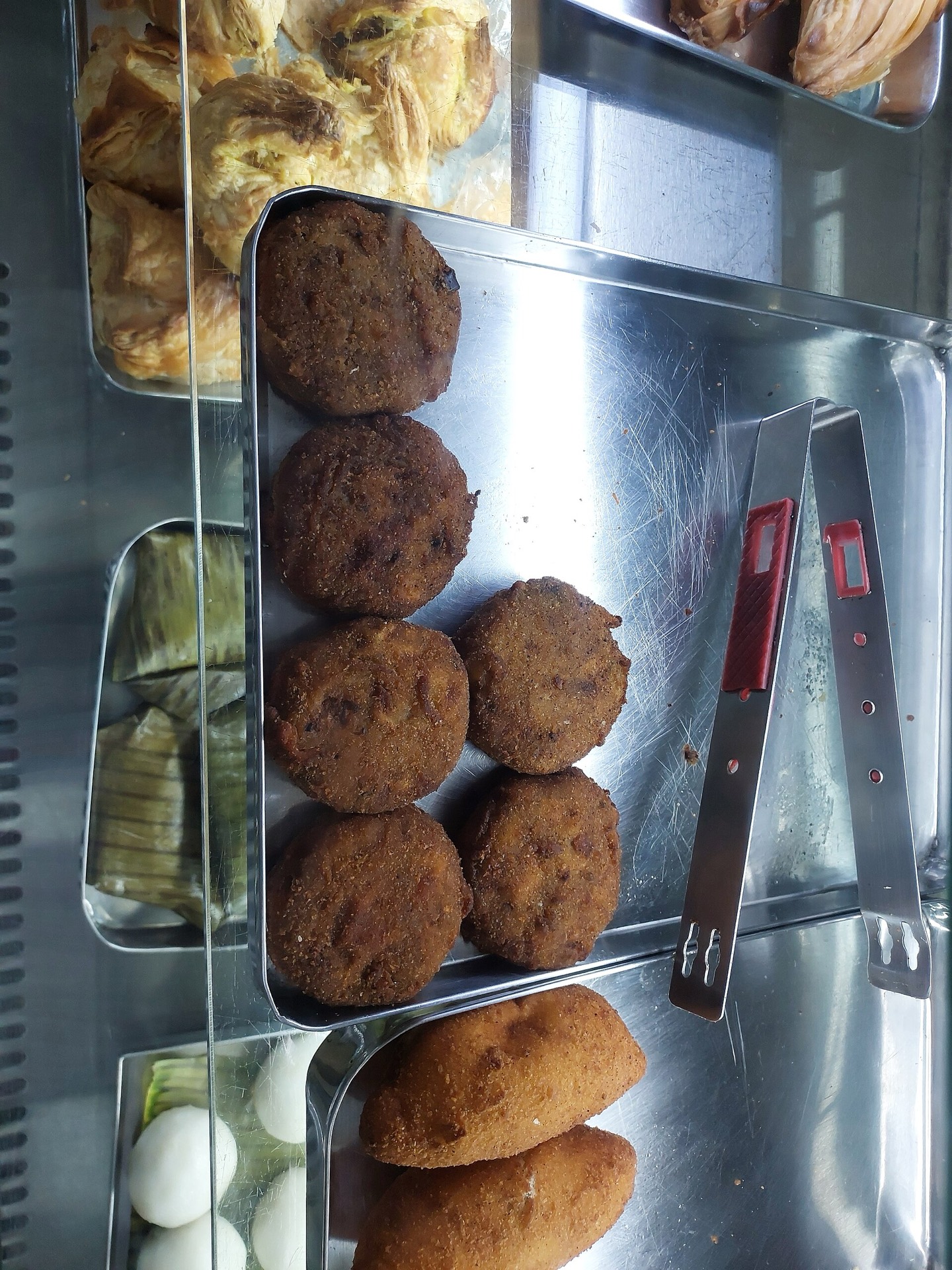 Golden crumb-coated Kerala cutlets, one cut to show the spiced potato filling.