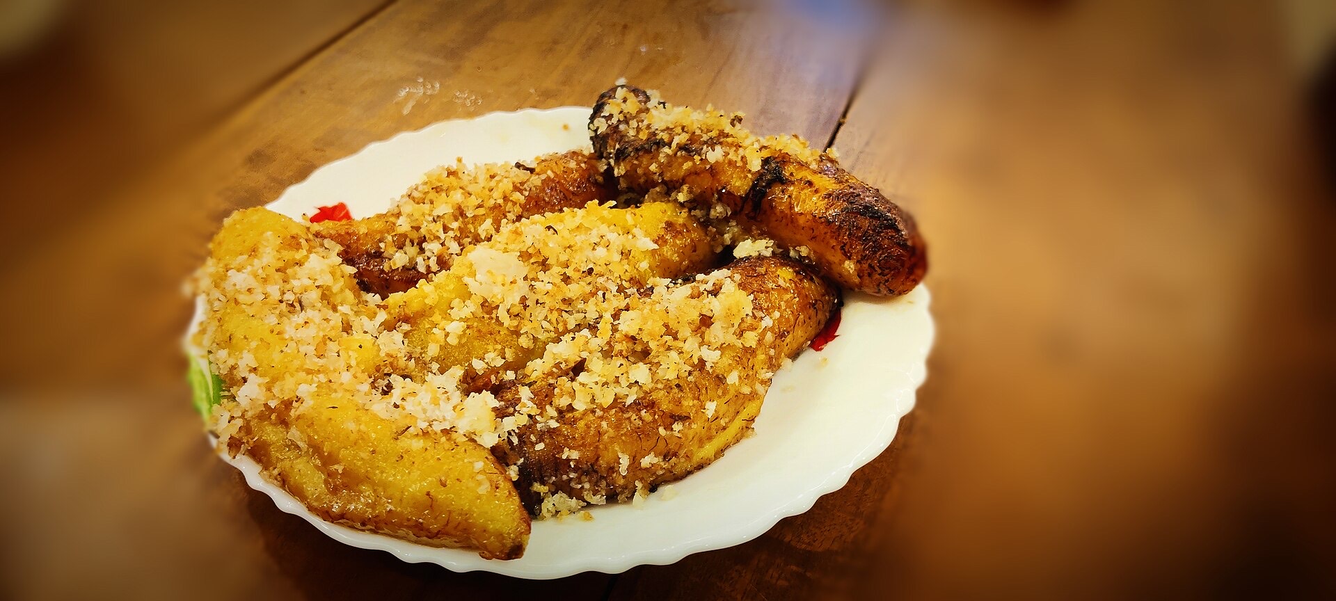 Pazham Nirachathu - a fried stuffed Nendran banana sliced to show the sweet coconut filling.